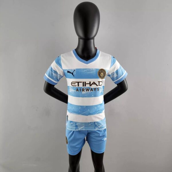 Manchester City 2022/23 Anniversary Kids Jersey And Shorts Kit - Image 2