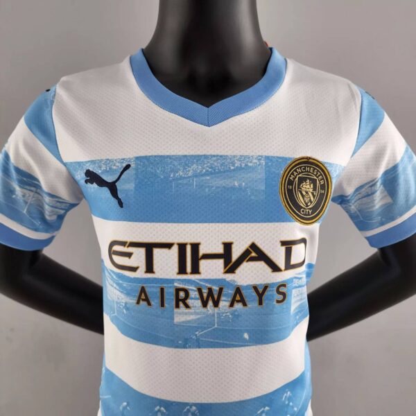 Manchester City 2022/23 Anniversary Kids Jersey And Shorts Kit - Image 4